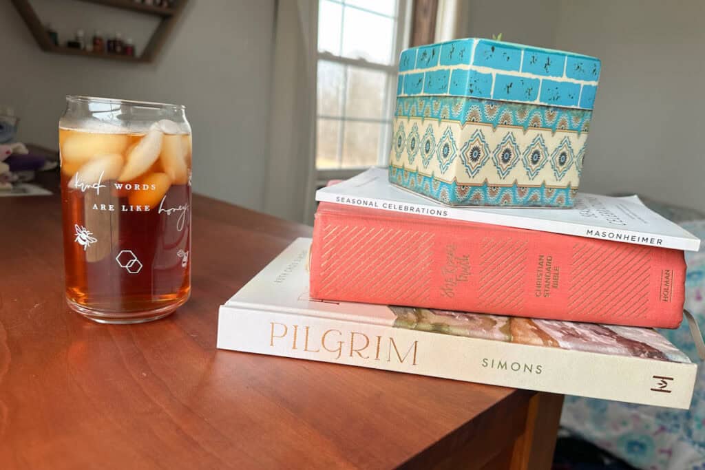 iced tea and stack of books
