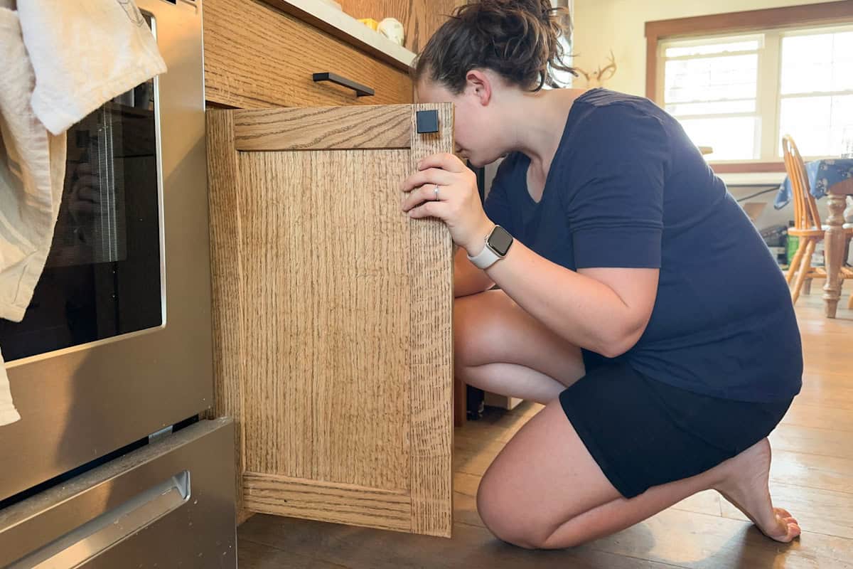Marie browsing the cupboard.